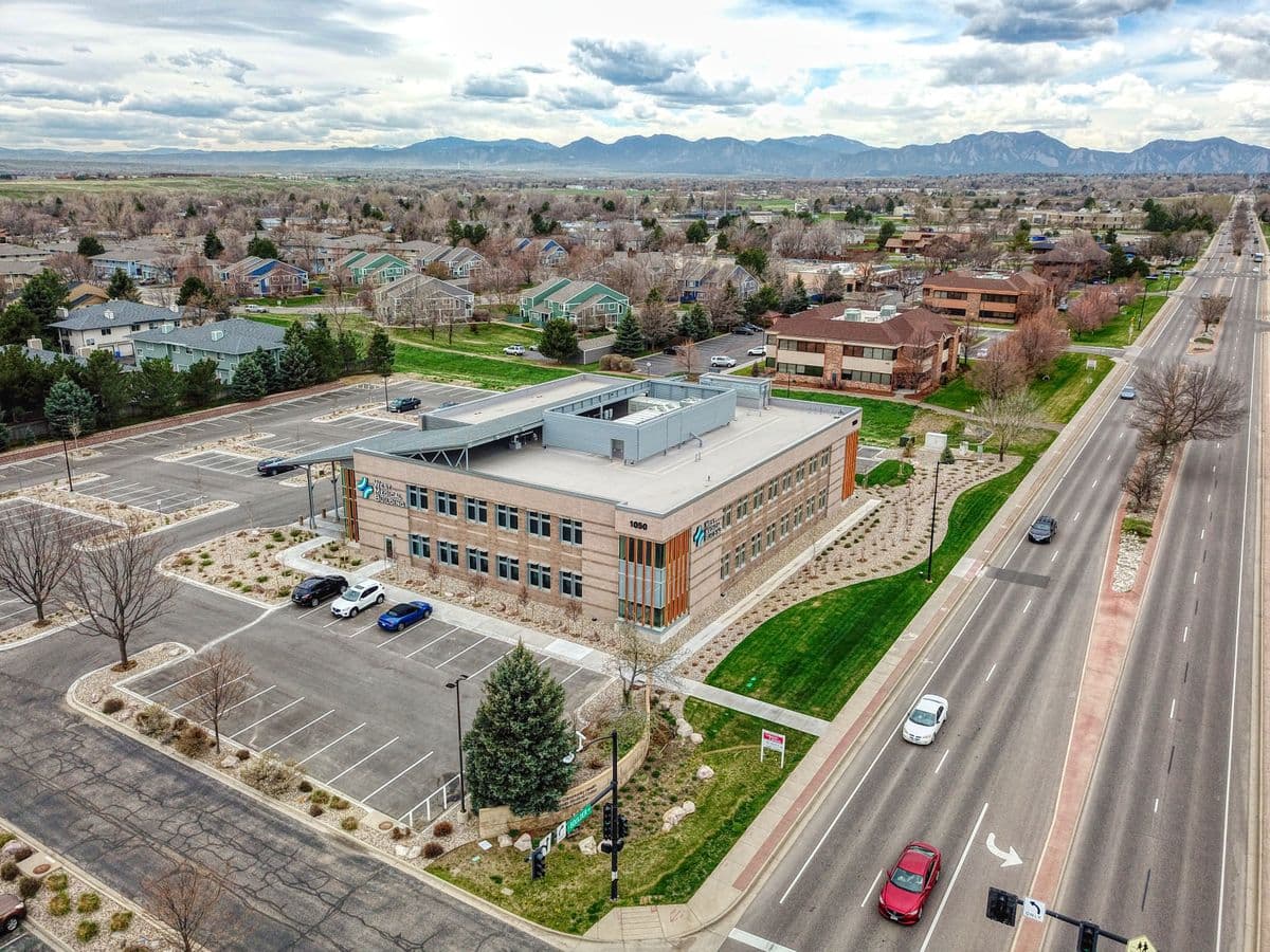 Aerial view of the West Medical Building at 1050 W South Boulder Rd, with the Flatirons behind