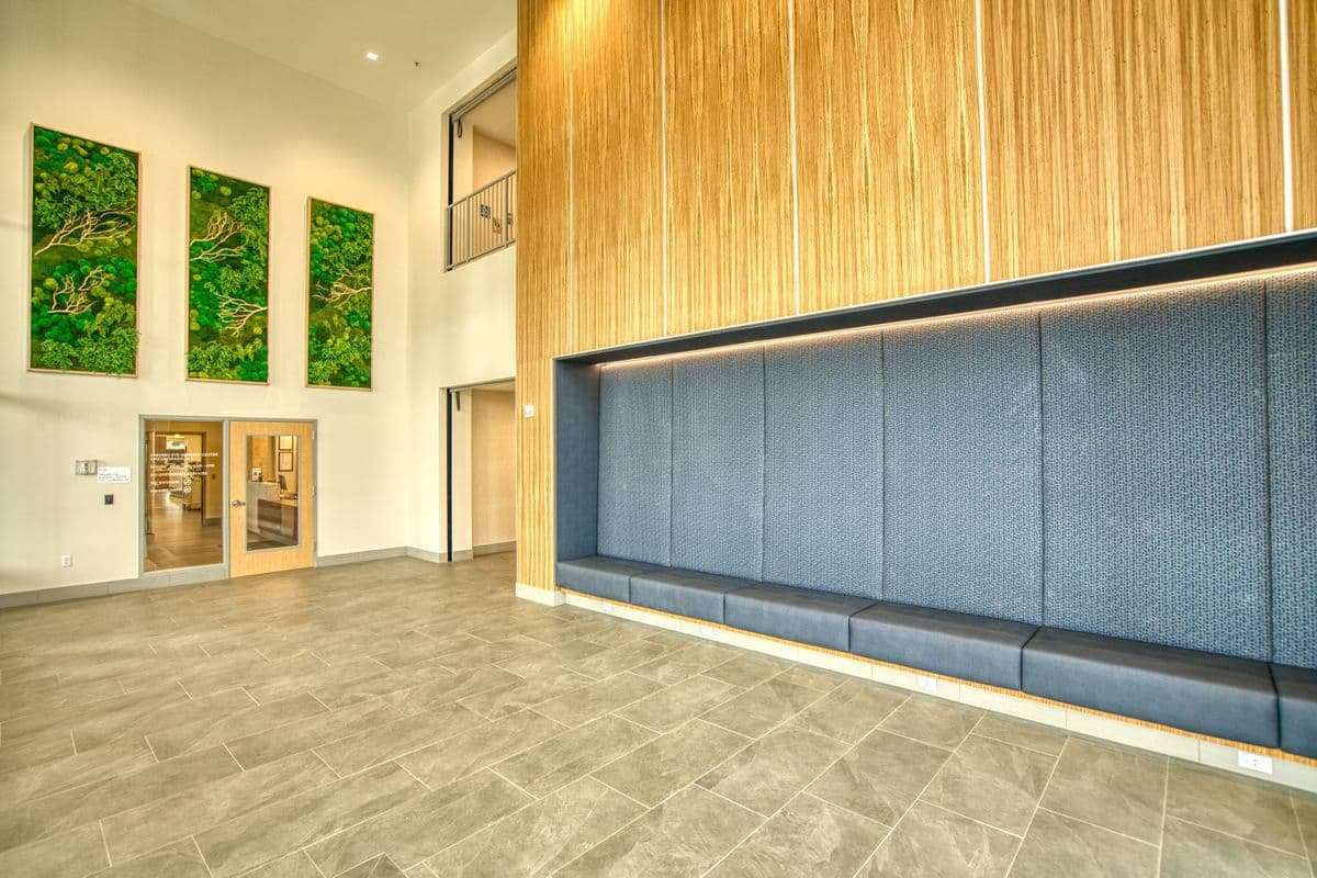 The lobby outside Premier Eye Surgery Center, with moss wall art and the glass door to the center
